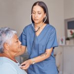 Elderly patient, nursing and nurse with a stethoscope listening to heartbeat during a health consul